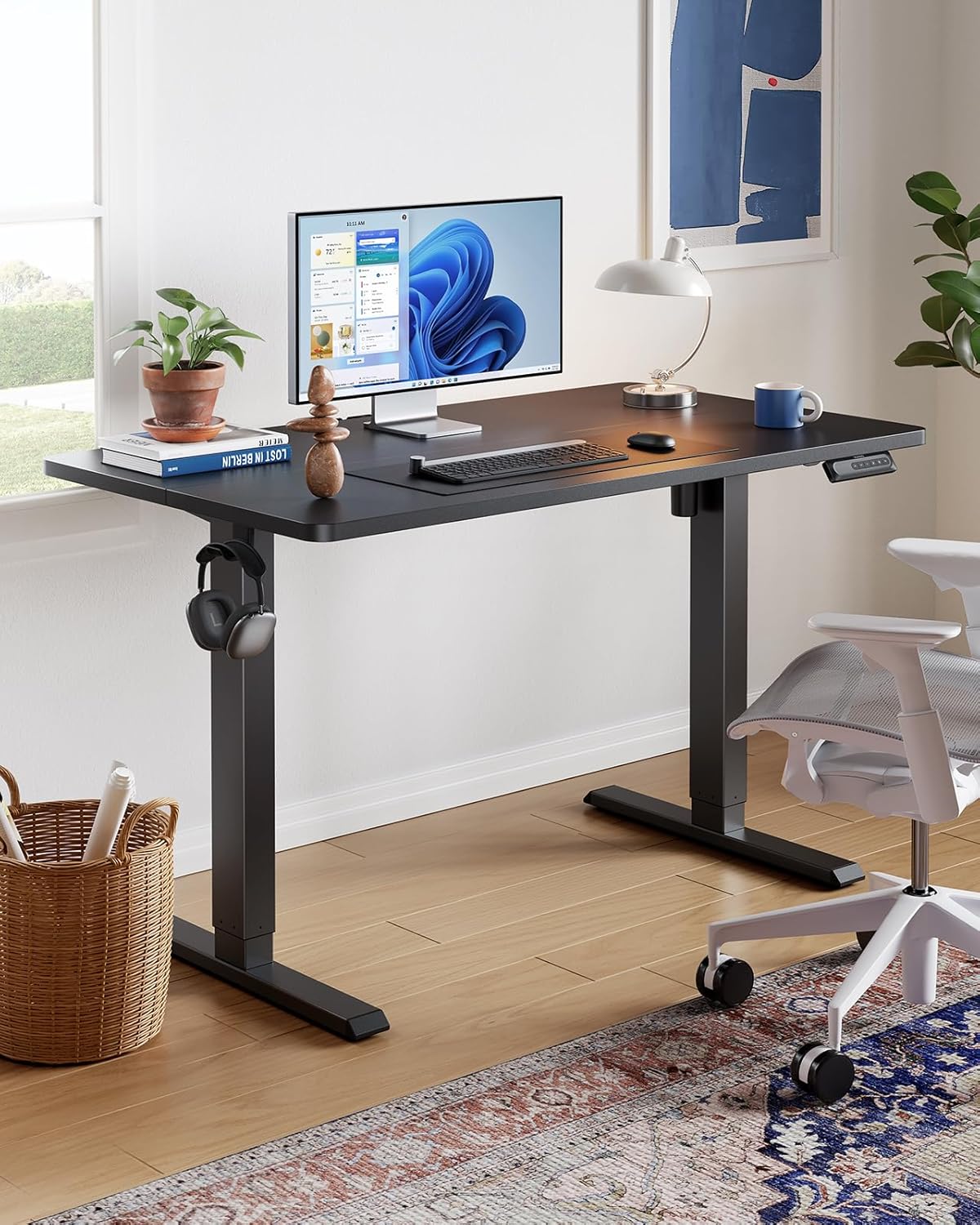 HUANUO 63" x 28" Electric Standing Desk Adjustable Height, 4 Memory Height Settings, Headphone Hook, Cable Manager, Sit Stand Up Desk for Home Office & Computer Workstation, Black